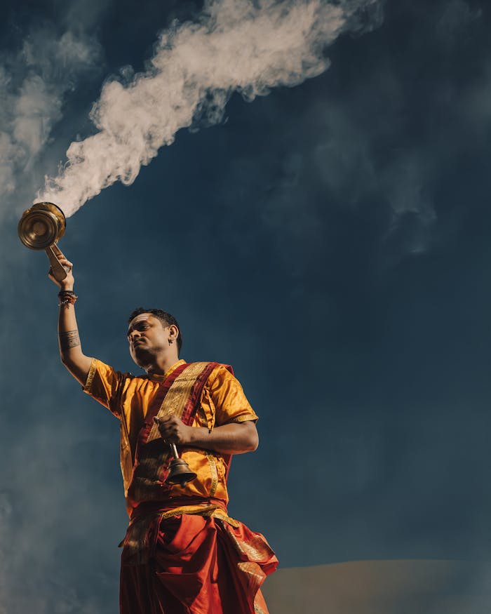 The Art of Drawing Readers In: Your attractive post title goes here Man performing a cultural ritual with incense smoke, emphasizing spirituality and tradition.